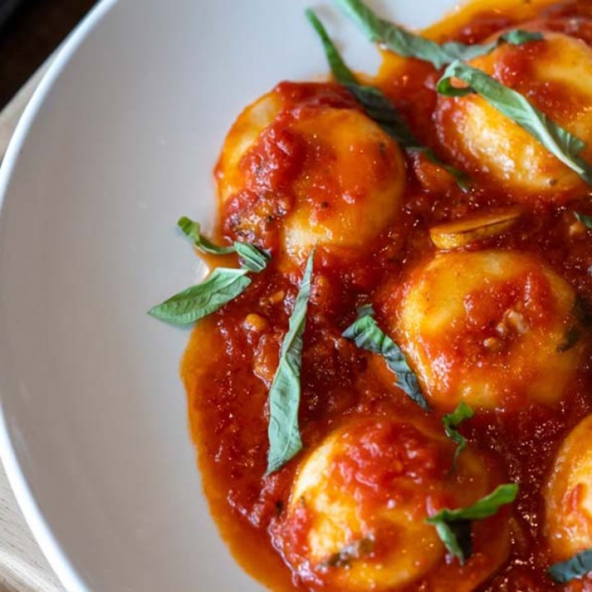 Catering tray of meatballs in tomato sauce