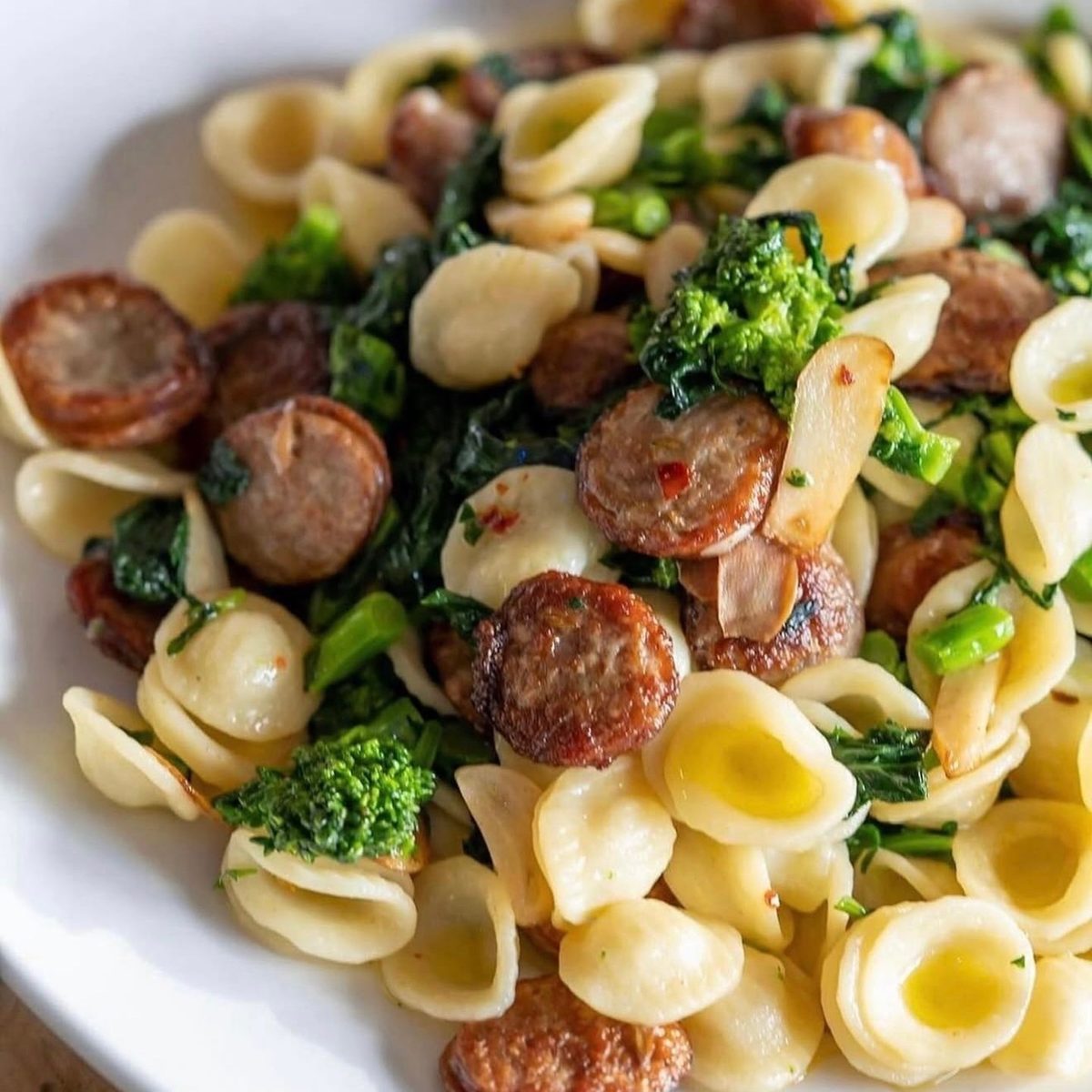 Catering tray of orecchiette with sausage and broccoli rabe