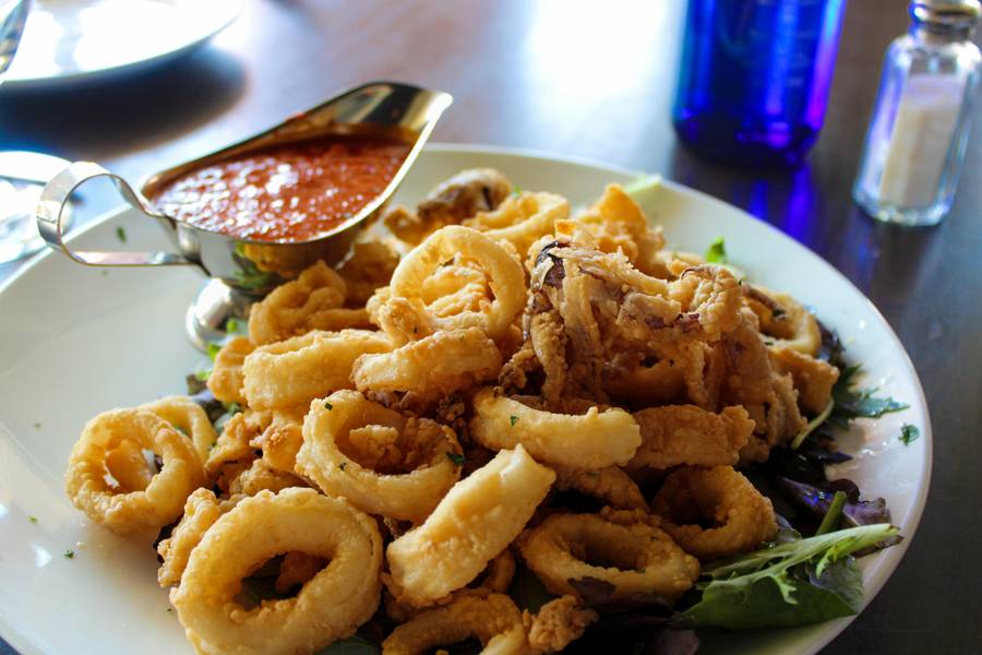 Crispy calamari with a boat of marinara sauce