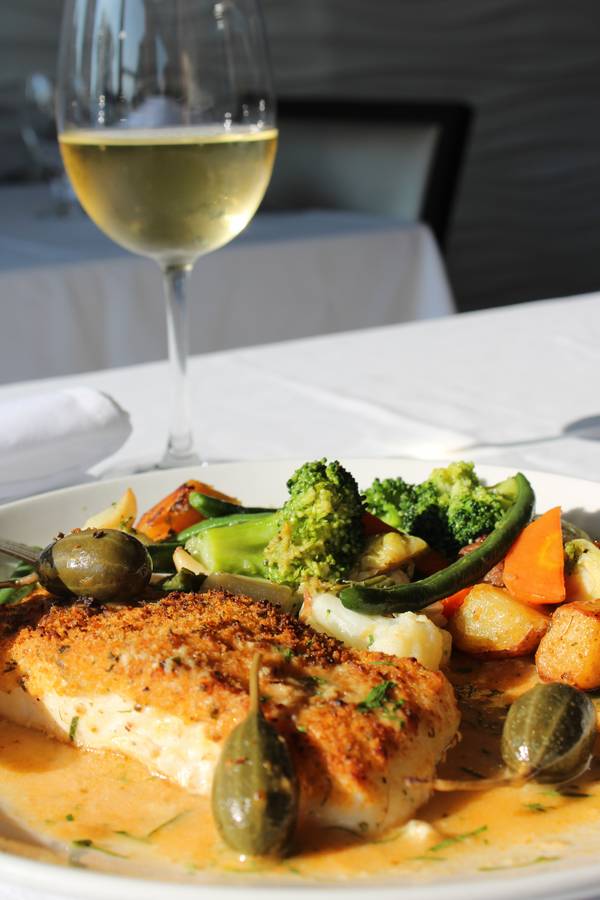 Halibut oreganata with caper berries and roasted vegetables